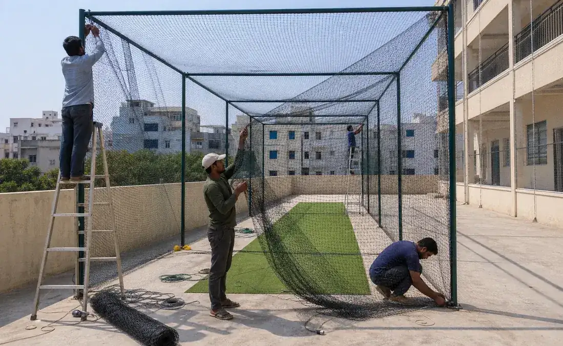 Terrace cricket net during installation in Hyderabad