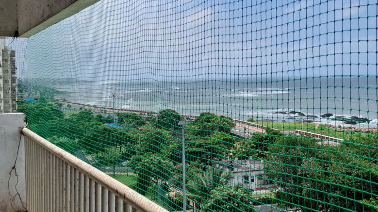 Pigeon safety net after fixing on apartment balcony in Hyderabad