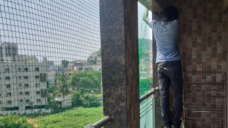 Pigeon safety net installation for balcony in progress in Hyderabad